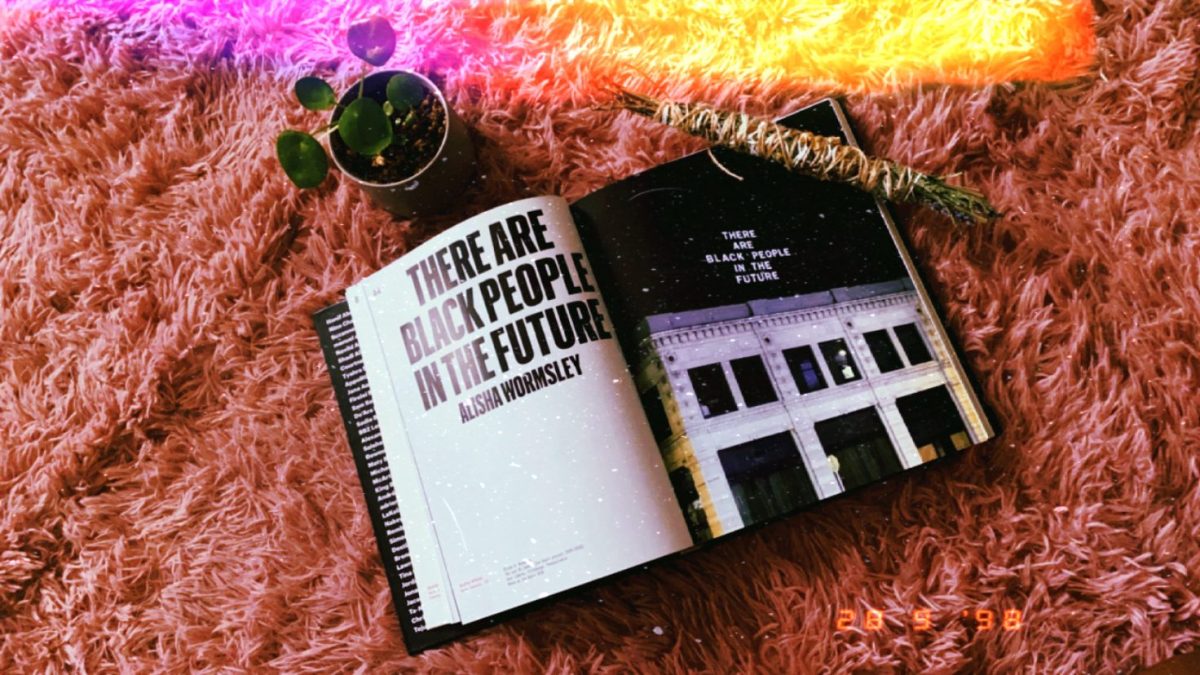 Image shows an excerpt from the book "Black Futures" called "There are black people in the future". There is a cleansing bundle and a small plant in the frame.