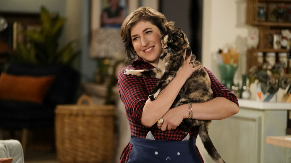 Mayim Bialik holds a cat in Call Me Kat. 