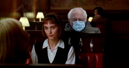 A cut out of Bernie Sanders peers over Therese's shoulder during lunch in a 1950s bar in "Carol" 
