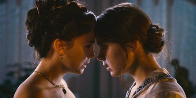 Emily and Sue press their foreheads together in season two of Dickinson.