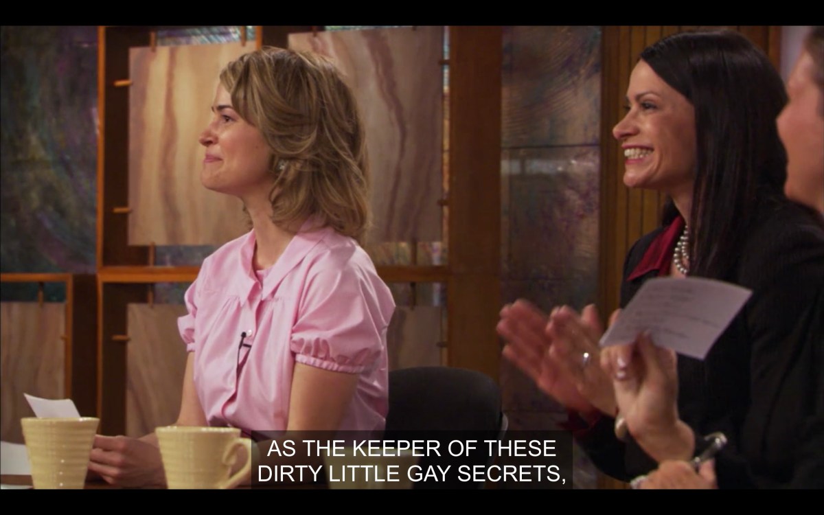 Alice on "The Look" in a pink silk shirt saying she is more than the keeper of dirty little gay secrets
