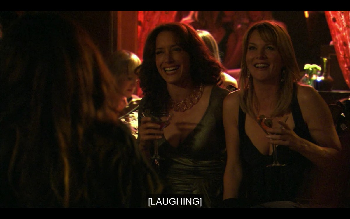 Bette and Tina are laughing at the club
