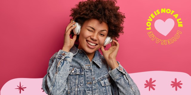 A person wearing headphones and winking