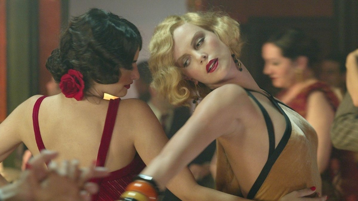 Charlize Theron in a sexy outfit dancing in "Head in the Clouds"