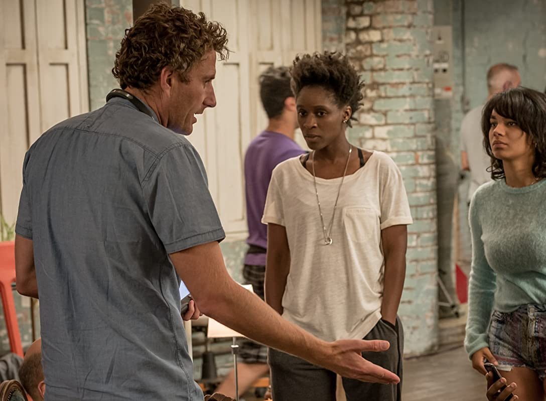 A still from "Cucumber" of multiple characters in a loft apartment