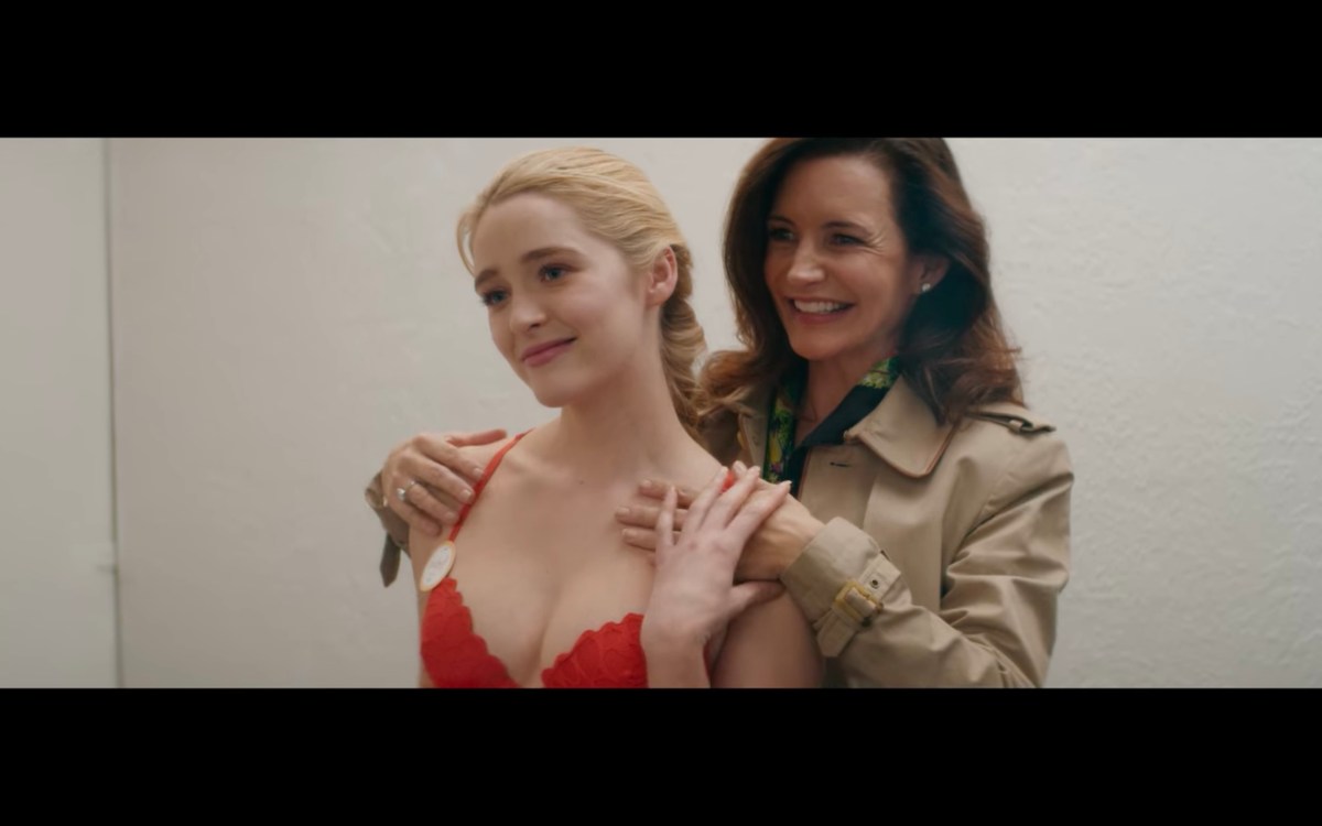 Grace pulls Mary's hand closer to her breast, while wearing a new red bra