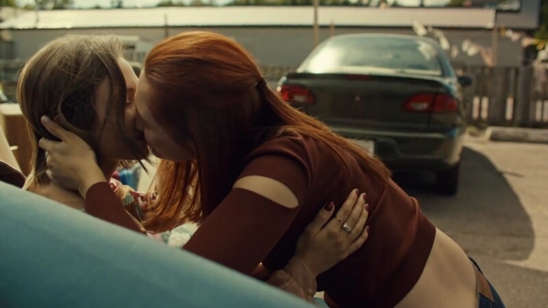Waverly Earp and Nicole Haught make out on the couch from Nedley's office in a motel parking lot.