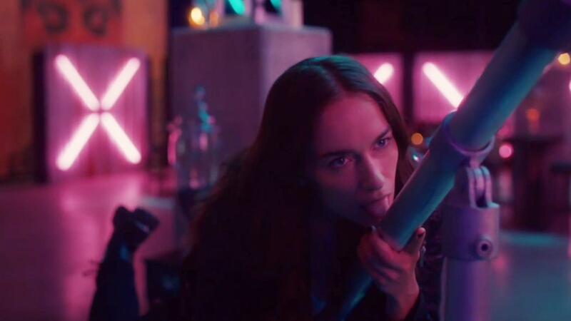 Wynonna Earp leans on a railing sexily and sticks her tongue out to lick the pole in an apparent attempt to flirt.