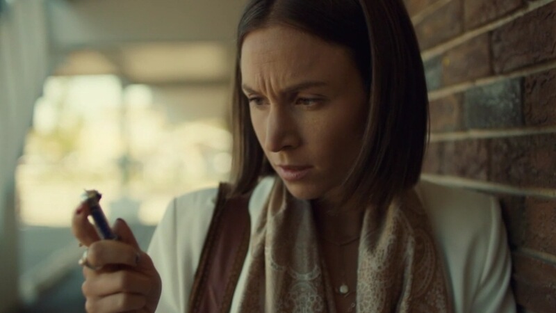 Waverly scrunches her eyebrows while inspecting the little glass vial of cupid glitter.