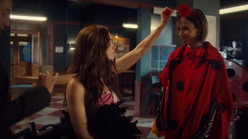 Wynonna Earp squeezes a ball on the ladybug antenna Waverly is wearing to top off her adorable Halloween costume. 
