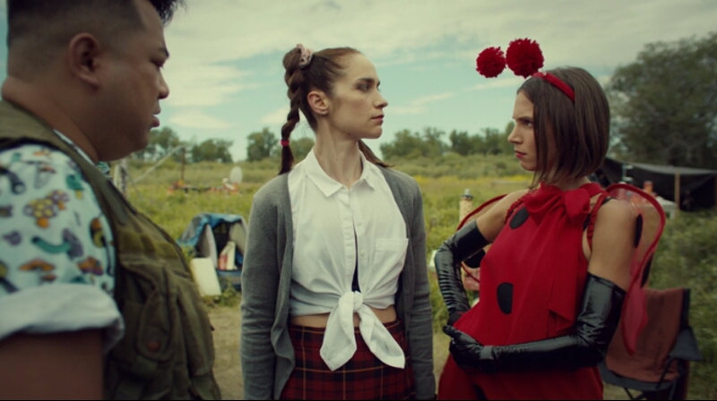 Waverly and Wynonna, dressed as a ladybug and Britney Spears, look at each other in confusion.