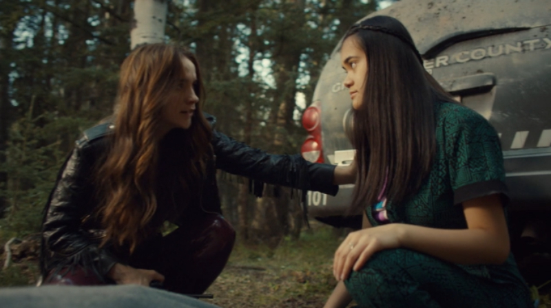 Wynonna puts a comforting hand on Rachel's arm.