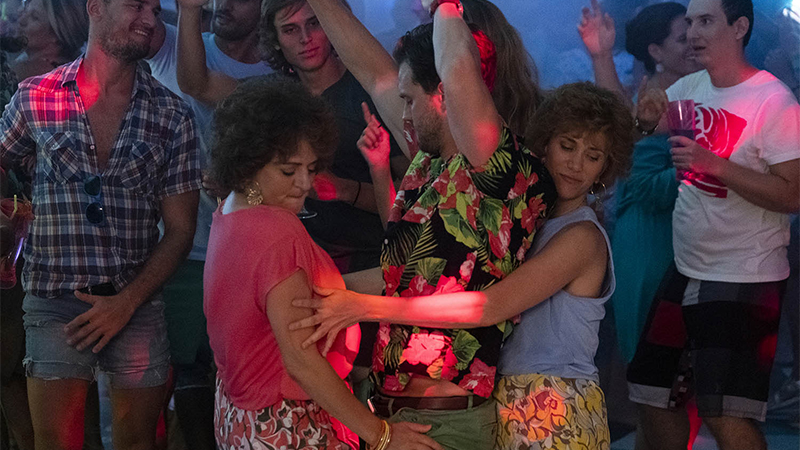 Annie Mumolo and Kristin Wiig dance up on Barb's love interest. 