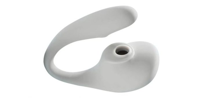 A photo of the Osé 2, a light gray toy with a large, bulbous round end that includes a suction area for air pressure and a curved arm looping back around and above it for internal stimulation.