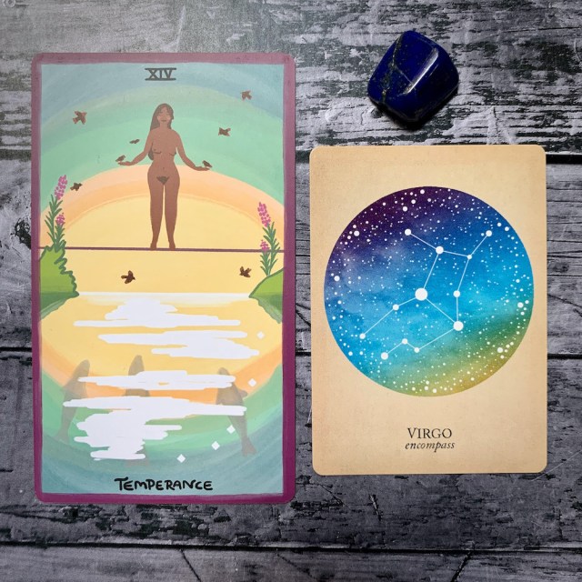 A photo of the tarot card for Temperance and the astrological card representing Virgo, along with a small crystal