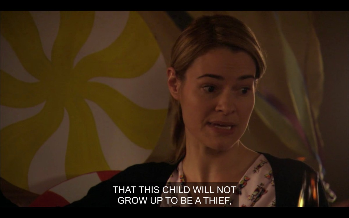 Alice giving a baby shower toast that ends with "that this child will not grow up to be a thief"