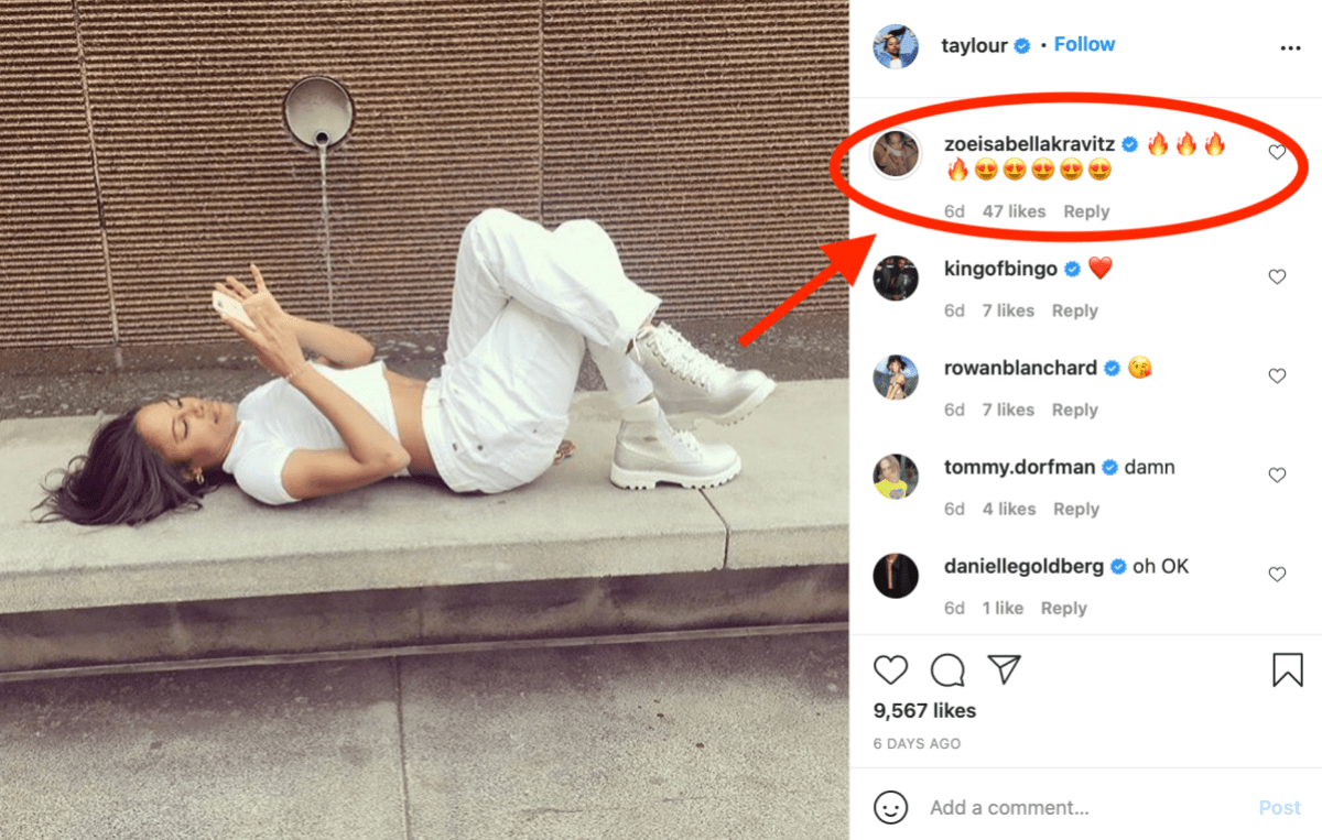 Taylour Paige is on her phone laying down against a concrete slab in a white shirt and white pants in an Instagram post, Zoe Kravitz responds with four fire emojis and five heart-eyed emojis.