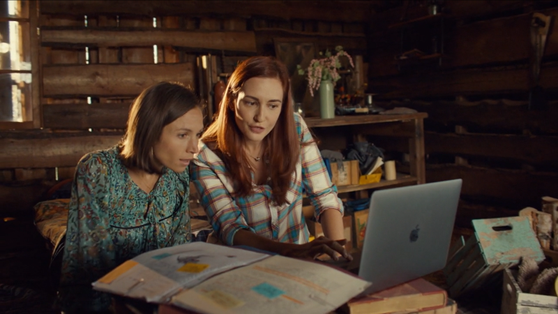 Wynonna Earp series finale recap: Nicole and Waverly look at a laptop together.