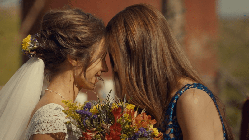 The Earp sisters press their foreheads together.