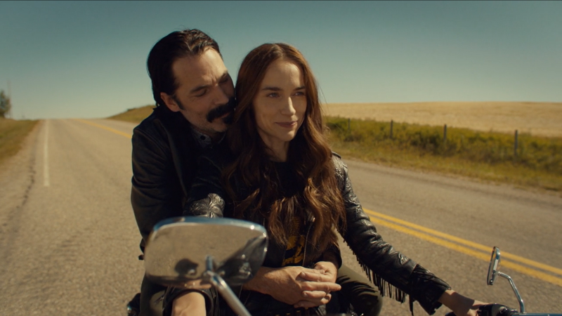 Wynonna Earp series finale recap: Doc wraps his arms around Wynonna's waist on her motorcycle.
