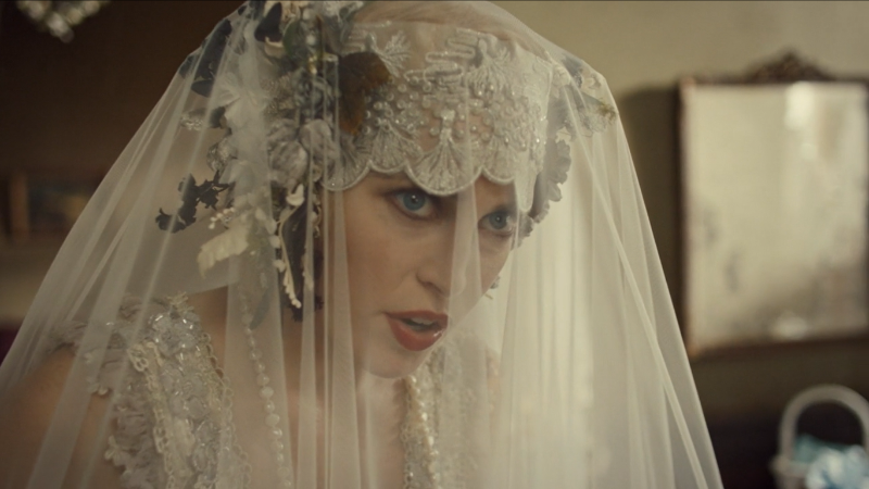 Wynonna Earp series finale recap: Brigitte played by Charlotte Sullivan gives crazy eyes through a veil.