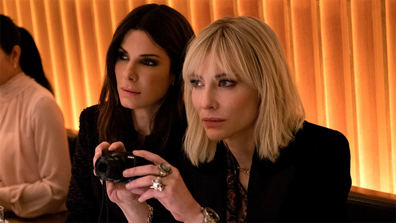 Cate Blanchett and Sandra Bullock sit together in Ocean's 8