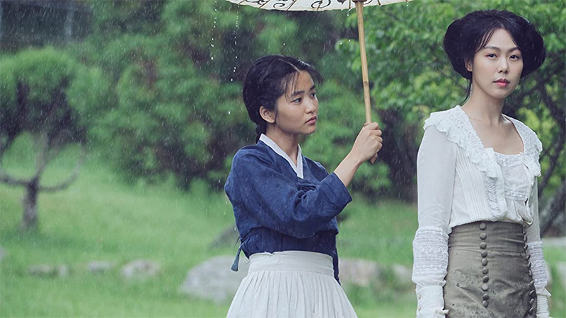 The women of The Handmaiden stand in the rain