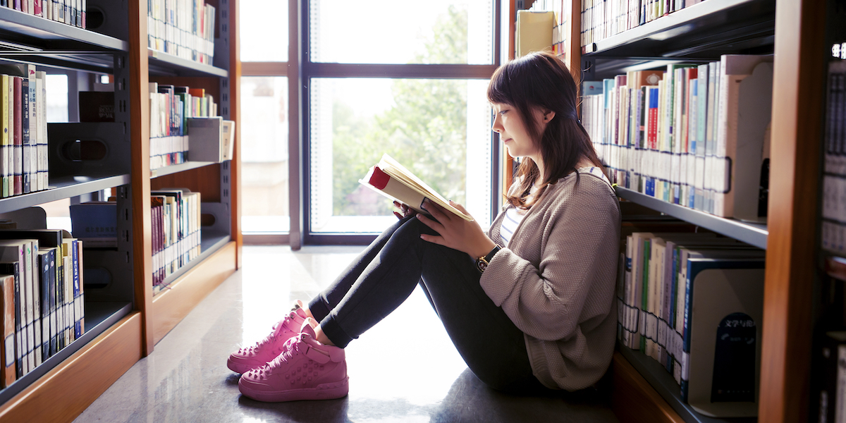 reading among bookshelves