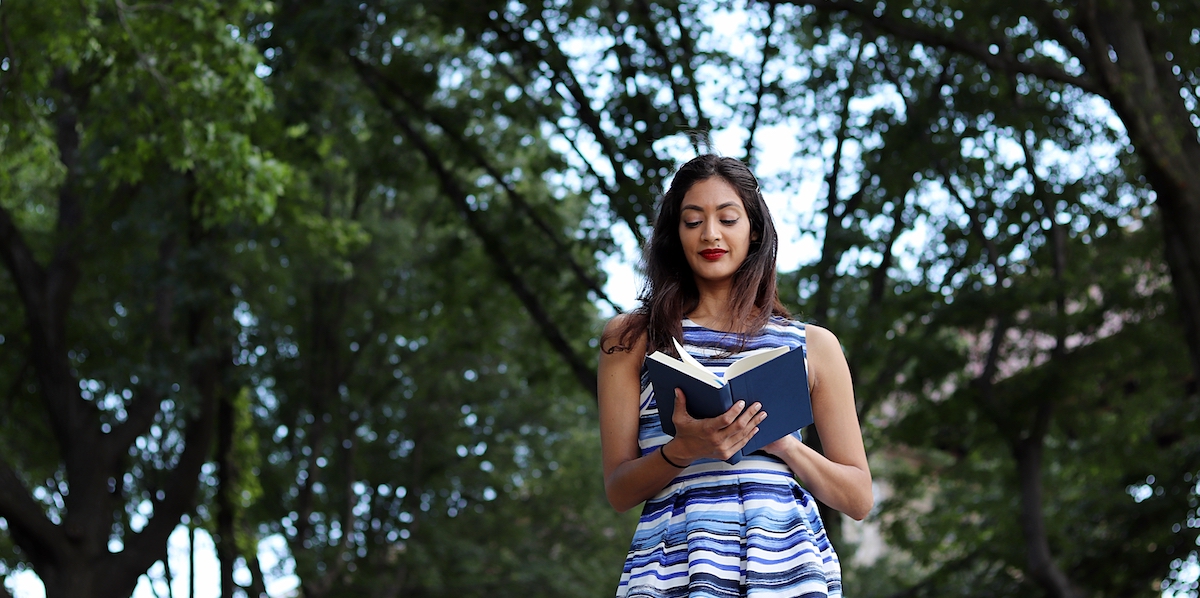 reading outside under trees