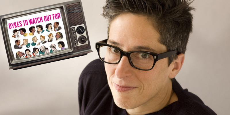 Alison Bechdel is against a white background in a black t shirt and black glasses. Next to her is a cut out of a television set with the cover of "Dykes to Watch Out For" photoshopped inside of it