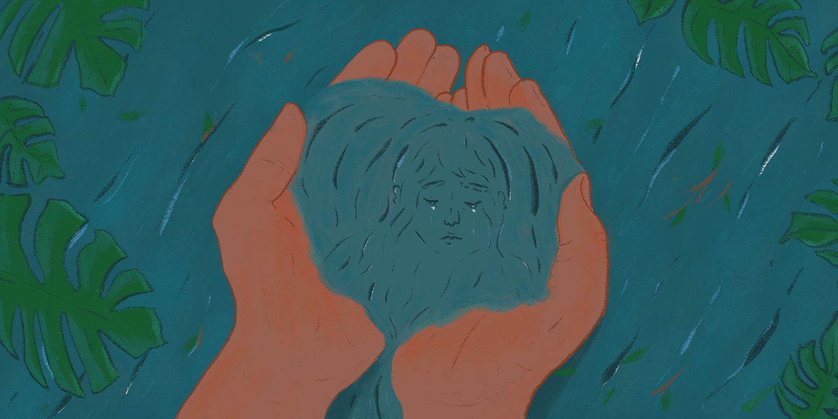 A pair of brown hands scoop up water, within the dark turquoise pool gathering in the palms is the reflection of a face.