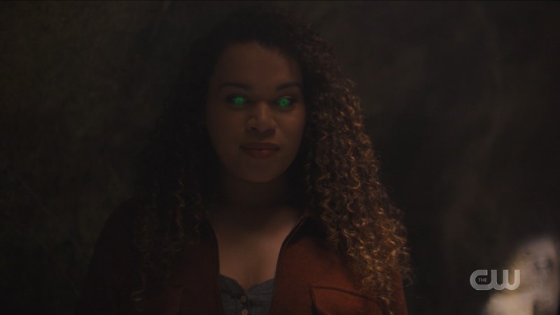 Screenshot from Charmed: Trans witch Josefina's eyes glow green with magic