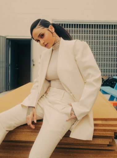 Image shows Kehlani in an all white suit.