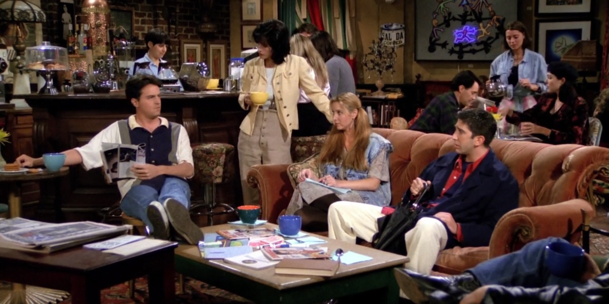 Monica, Phoebe, and Ross look at Chandler in the middle of the Central Perk coffee shop