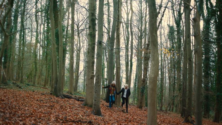 Mae and George on a hike in Feel Good season two