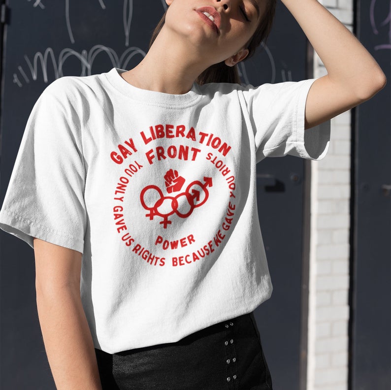 white t-shirt that says 'Gay Liberation Front" on it in a circular logo with red print