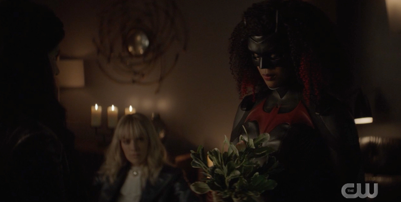 Batwoman presents the Desert Road plant, Alice is in the background
