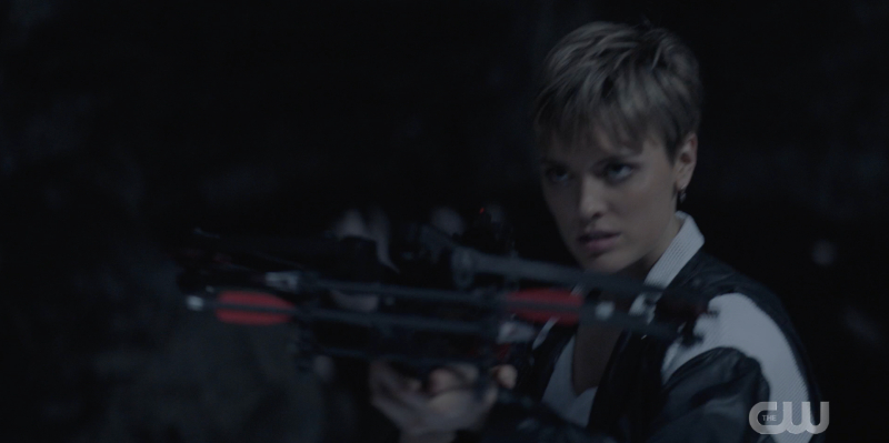 Wallis Day shoots a crossbow at night