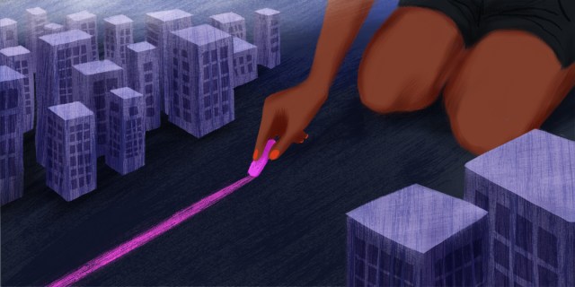 A Black figure wearing pink nail polish sits on their knees. On either side, there are small city buildings. The person is drawing a line down the middle of the city with pink chalk.