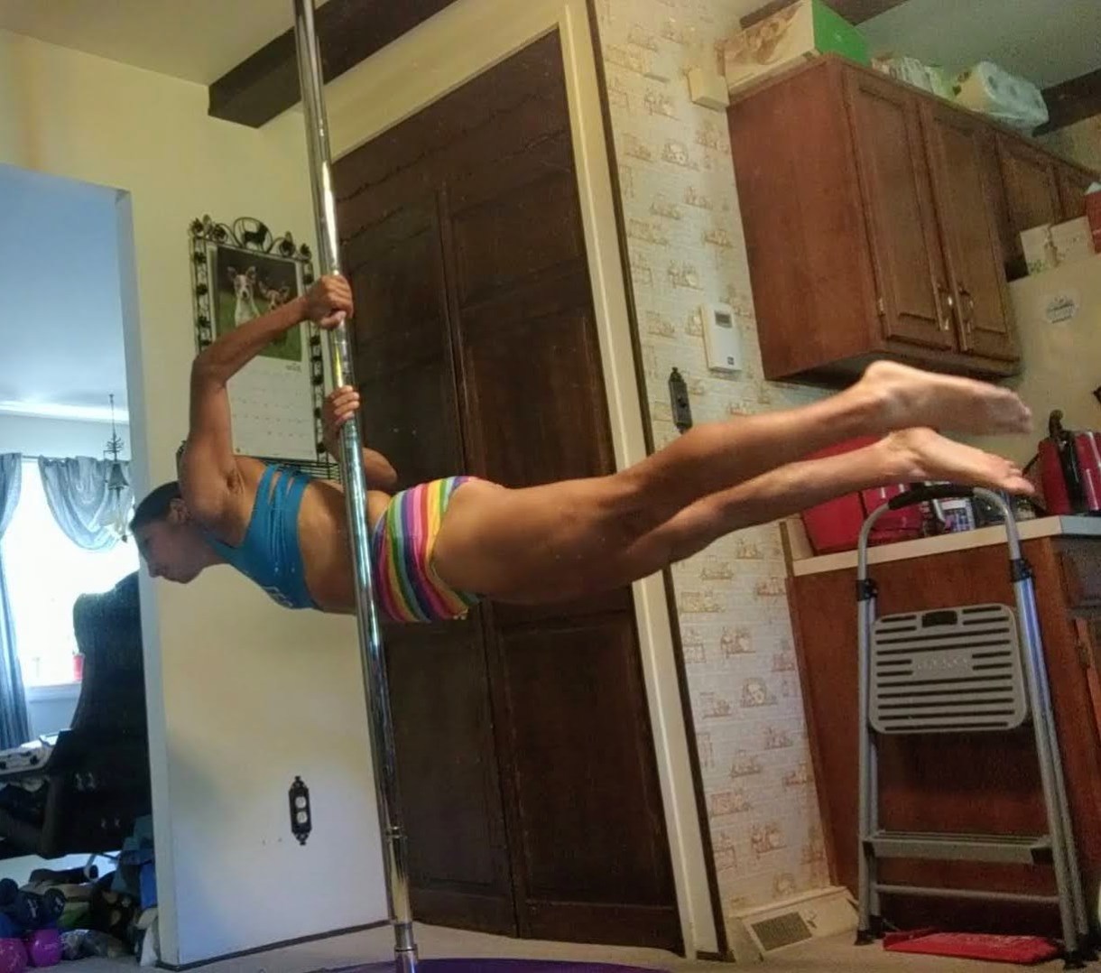 Erin pole dancing at home