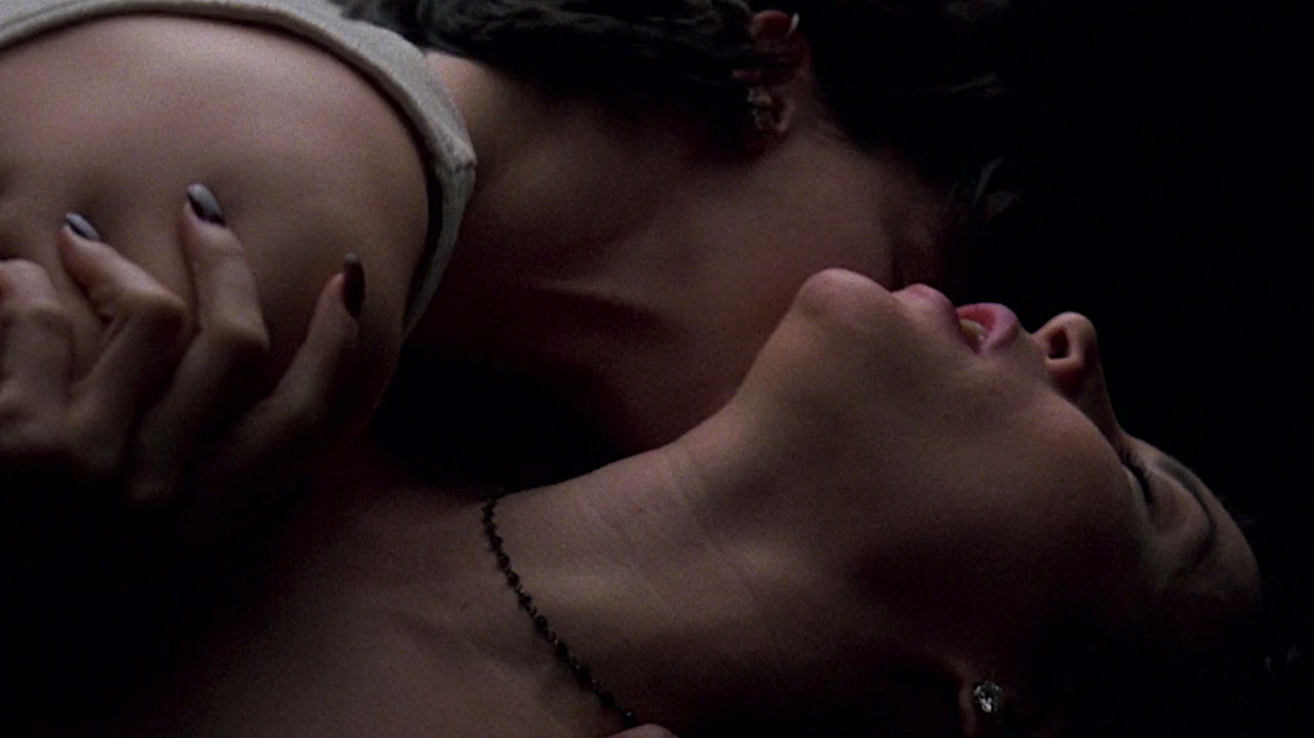 Lesbian Sex Scenes: Jennifer Tilly tilts her head back as Gina Gershon kisses her neck.