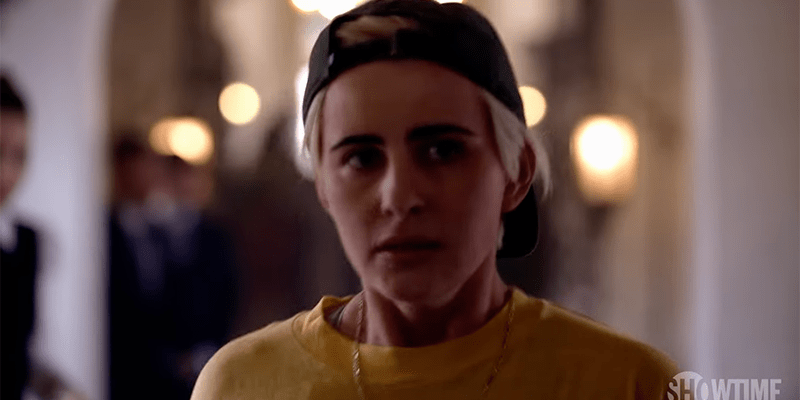 The L Word Generation Q Season 2 Trailer: Sophie in a black backwards baseball cap and yellow shirt, looking concerned