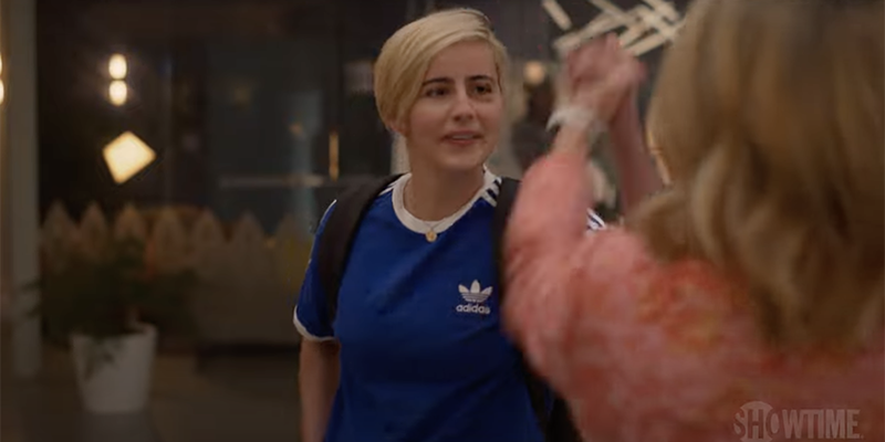 The L Word Generation Q Season 2 Trailer: Finely with a black eye in a blue Adidas soccer shirt giving a high five