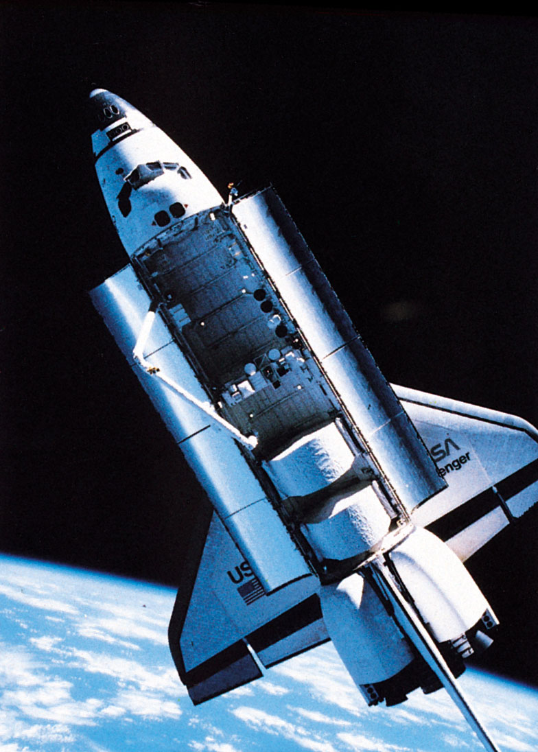 The challenger space shuttle orbiting above Earth