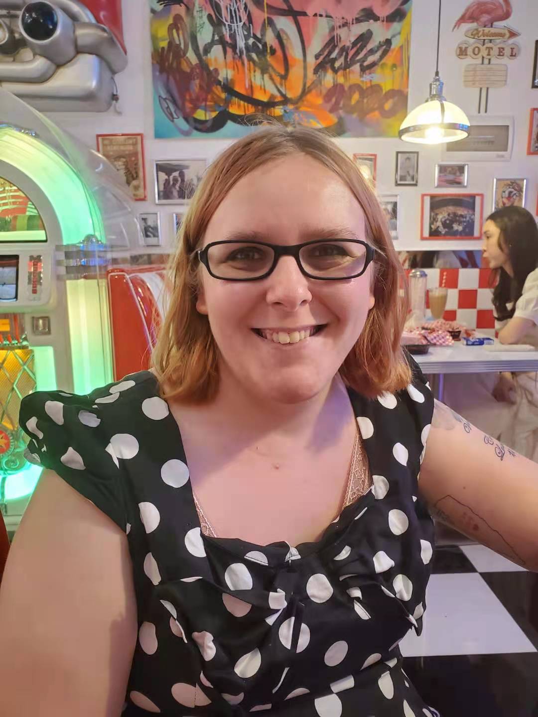 Abelina at a diner in a polka dot dress