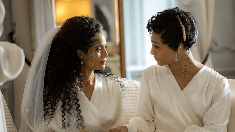 MJ Rodriguez and Indya Moore in white wedding day outfits
