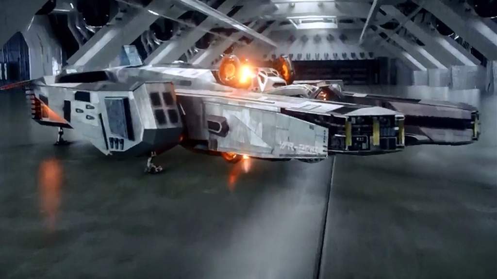 The Waverider time ship from Legends of Tomorrow docked in a huge hangar