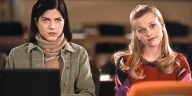 In a still from Legally Blonde, Vivian and Elle are sitting together while working on their laptops.