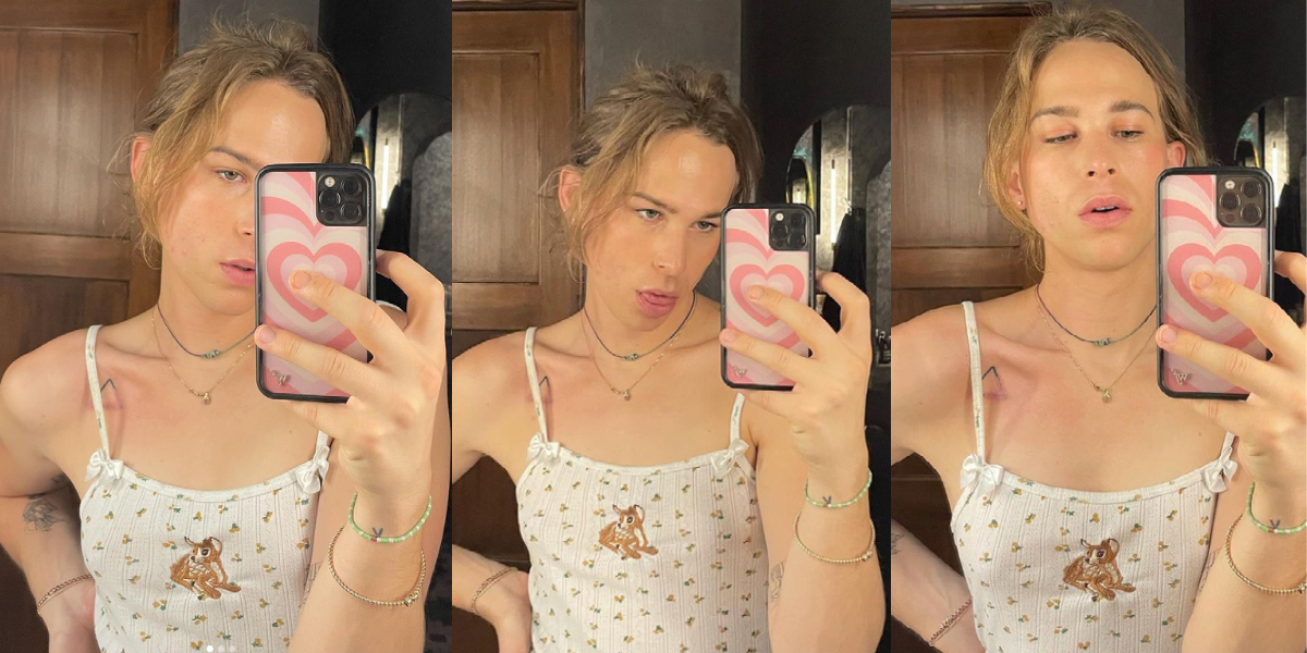 Tommy taking selfies with her hair pulled up into a small messy bun