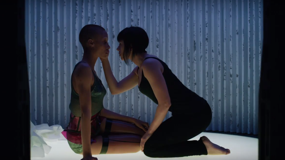 A still from Ghost in the Shell where it looks like two women are about to kiss